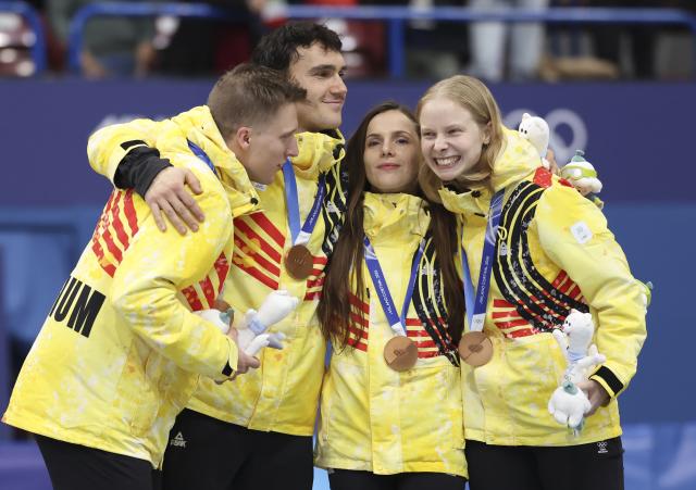 (260210) -- MILAN, Feb. 10, 2026 (Xinhua) -- Bronze medalists team Belgium react during the awarding ceremony for the short track speed skating mixed team relay at the Milan-Cortina 2026 Olympic Winter Games in Milan, Italy, Feb. 10, 2026. (Xinhua/Li Ming)