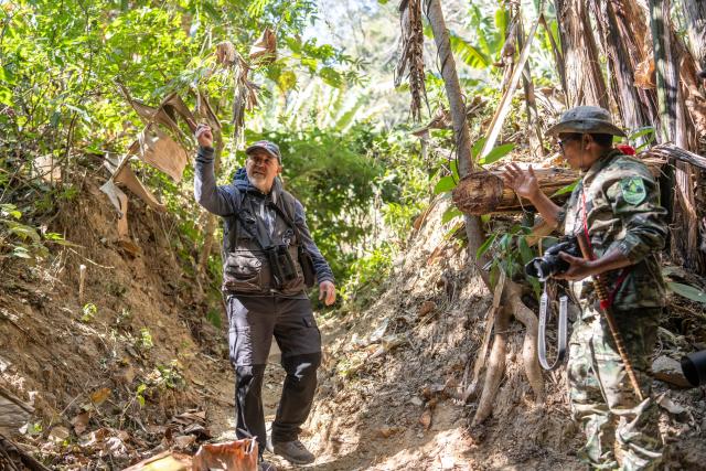 (260210) -- YINGJIANG, Feb. 10, 2026 (Xinhua) -- A member of the "Hornbill Patrol Team" chats with a foreign tourist who comes to watch birds in Shiti Village, Yingjiang County, southwest China's Yunnan Province, Feb. 6, 2026. In Yunnan Tongbiguan provincial nature reserve, hornbills, a species under first-class state protection in China, are in a critical period of breeding preparation. Members of the "Hornbill Patrol Team" conduct regular patrols to ensure their safety during the breeding season.
   The "Hornbill Patrol Team" is composed of local villagers and forest rangers. Since its establishment in 2021, the team has grown to 26 members. Apart from patrolling, many of them also work as bird-watching guides or are involved in the ecological industry, achieving a positive interaction between ecological conservation and community development. (Xinhua/Gao Yongwei)