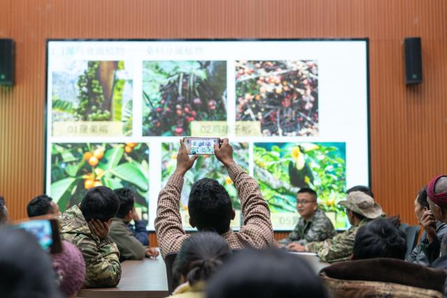 (260210) -- YINGJIANG, Feb. 10, 2026 (Xinhua) -- Villagers learn about knowledge of hornbills in Shiti Village, Yingjiang County, southwest China's Yunnan Province, Feb. 5, 2026. In Yunnan Tongbiguan provincial nature reserve, hornbills, a species under first-class state protection in China, are in a critical period of breeding preparation. Members of the "Hornbill Patrol Team" conduct regular patrols to ensure their safety during the breeding season.
   The "Hornbill Patrol Team" is composed of local villagers and forest rangers. Since its establishment in 2021, the team has grown to 26 members. Apart from patrolling, many of them also work as bird-watching guides or are involved in the ecological industry, achieving a positive interaction between ecological conservation and community development. (Xinhua/Gao Yongwei)