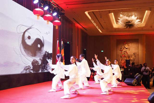 (260210) -- COLOMBO, Feb. 10, 2026 (Xinhua) -- A Taichi performance is staged at a Chinese New Year reception in Colombo, Sri Lanka, Feb. 9, 2026. Members of the Chinese community in Sri Lanka, together with local Sri Lankan guests, gathered here on Monday evening to feel the vibe of Chinese New Year at a reception hosted by the Chinese Embassy in Sri Lanka.
   TO GO WITH "Chinese community in Sri Lanka celebrates Spring Festival at embassy reception" (Xinhua/Wu Ziyu)