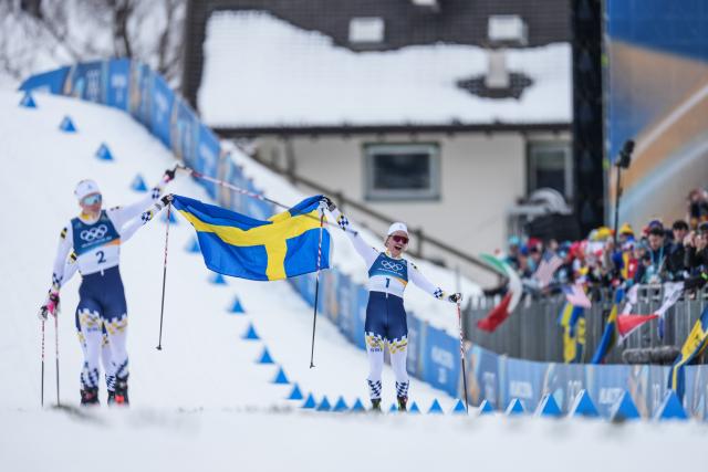 (260210) -- TESERO, Feb. 10, 2026 (Xinhua) -- Linn Svahn (R) and Jonna Sundling of Sweden celebrate during the cross-country skiing women's sprint classic final at the Milano Cortina 2026 Olympic Winter Games in Tesero, Italy, Feb. 10, 2026. (Xinhua/Peng Ziyang)