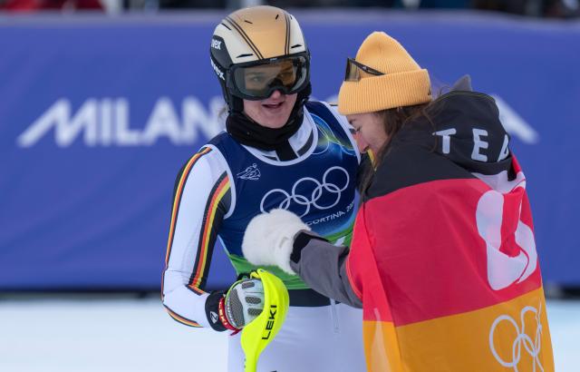 (260210) -- CORTINA D'AMPEZZO, Feb. 10, 2026 (Xinhua) -- Kira Weidle-Winkelmann (R) and Emma Aicher of Germany react after the slalom of the alpine skiing women's team combined at the Milan-Cortina 2026 Olympic Winter Games in Cortina, Italy, Feb. 10, 2026. (Xinhua/Fei Maohua)