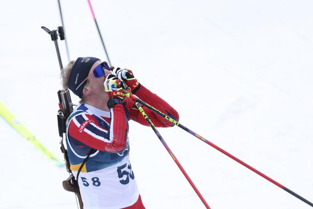 (260210) -- ANTERSELVA, Feb. 10, 2026 (Xinhua) -- Johan-Olav Botn of Norway celebrates after the biathlon men's 20km individual at the Milan-Cortina 2026 Olympic Winter Games in Anterselva, Italy, Feb. 10, 2026. (Xinhua/Zhang Tao)