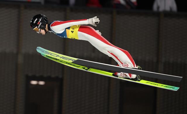 (260210) -- PREDAZZO, Feb. 10, 2026 (Xinhua) -- Liu Qi of China competes during the ski jumping mixed team match at the Milan-Cortina 2026 Olympic Winter Games in Predazzo, Italy, Feb. 10, 2026. (Xinhua/Huang Wei)