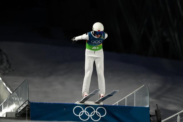 (260210) -- PREDAZZO, Feb. 10, 2026 (Xinhua) -- Song Qiwu of China competes during the ski jumping mixed team match at the Milan-Cortina 2026 Olympic Winter Games in Predazzo, Italy, Feb. 10, 2026. (Xinhua/Meng Yongmin)