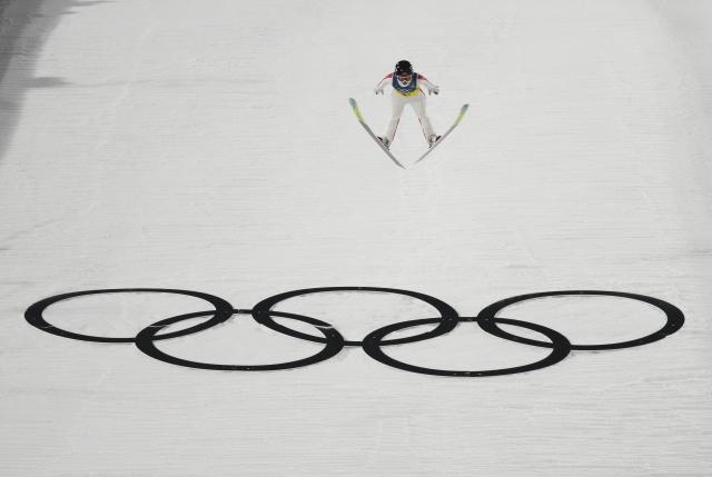 (260210) -- PREDAZZO, Feb. 10, 2026 (Xinhua) -- Liu Qi of China competes during the ski jumping mixed team match at the Milan-Cortina 2026 Olympic Winter Games in Predazzo, Italy, Feb. 10, 2026. (Xinhua/Huang Wei)