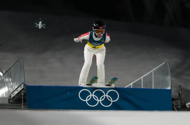 (260210) -- PREDAZZO, Feb. 10, 2026 (Xinhua) -- Liu Qi of China competes during the ski jumping mixed team match at the Milan-Cortina 2026 Olympic Winter Games in Predazzo, Italy, Feb. 10, 2026. (Xinhua/Meng Yongmin)