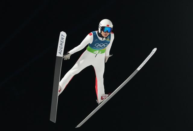 (260210) -- PREDAZZO, Feb. 10, 2026 (Xinhua) -- Song Qiwu of China competes during the ski jumping mixed team match at the Milan-Cortina 2026 Olympic Winter Games in Predazzo, Italy, Feb. 10, 2026. (Xinhua/Meng Yongmin)