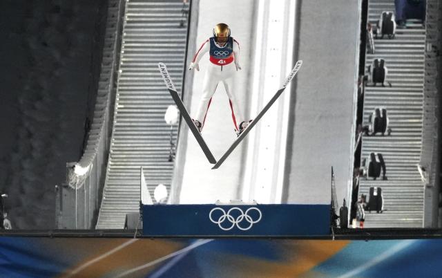 (260210) -- PREDAZZO, Feb. 10, 2026 (Xinhua) -- Zeng Ping of China competes during the ski jumping mixed team match at the Milan-Cortina 2026 Olympic Winter Games in Predazzo, Italy, Feb. 10, 2026. (Xinhua/Huang Wei)