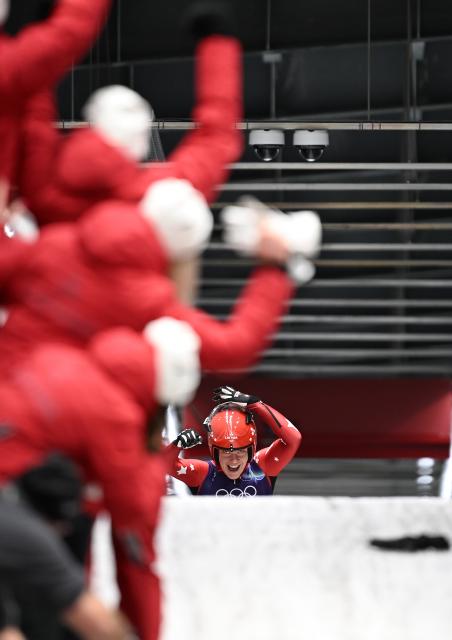 (260210) -- CORTINA D'AMPEZZO, Feb. 10, 2026 (Xinhua) -- Elina Bota of Latvia celebrates during the luge women's singles run 4 at the Milan-Cortina 2026 Olympic Winter Games in Cortina, Italy, Feb. 10, 2026. (Xinhua/Lian Yi)