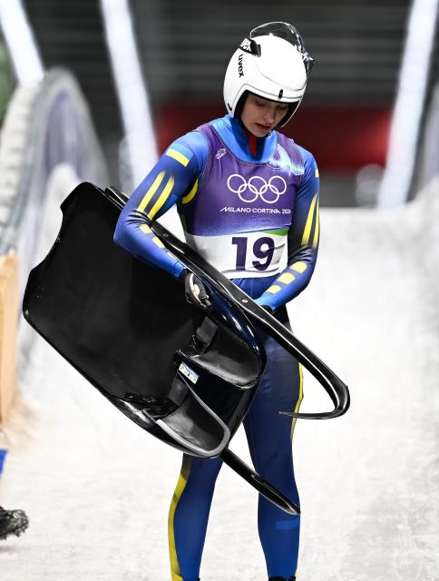 (260210) -- CORTINA D'AMPEZZO, Feb. 10, 2026 (Xinhua) -- Olena Smaha of Ukraine reacts after the luge women's singles run 3 at the Milan-Cortina 2026 Olympic Winter Games in Cortina, Italy, Feb. 10, 2026. (Xinhua/Lian Yi)