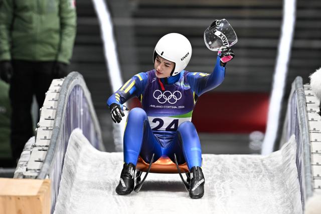 (260210) -- CORTINA D'AMPEZZO, Feb. 10, 2026 (Xinhua) -- Yulianna Tunytska of Ukraine reacts after the luge women's singles run 3 at the Milan-Cortina 2026 Olympic Winter Games in Cortina, Italy, Feb. 10, 2026. (Xinhua/Lian Yi)