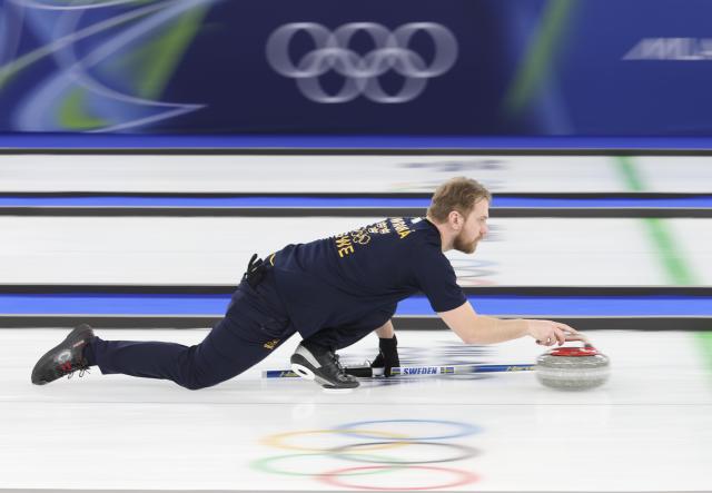 (260210) -- CORTINA D'AMPEZZO, Feb. 10, 2026 (Xinhua) -- Rasmus Wranaa of Sweden competes during the curling mixed doubles gold medal match between Sweden and the United States at the Milan-Cortina 2026 Olympic Winter Games in Cortina, Italy, Feb. 10, 2026. (Xinhua/Ding Xu)