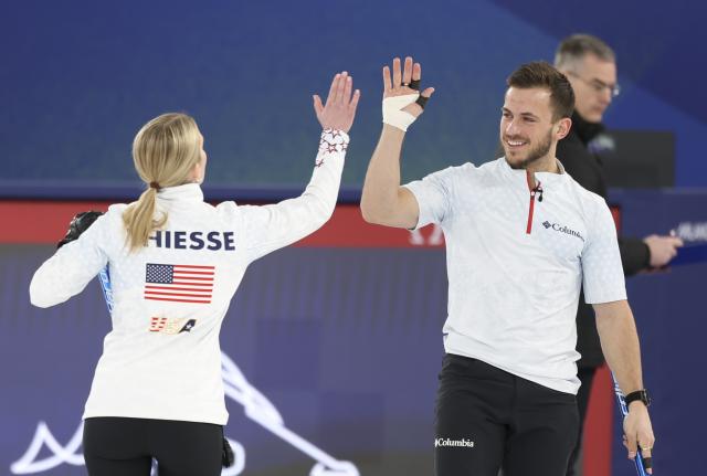(260210) -- CORTINA D'AMPEZZO, Feb. 10, 2026 (Xinhua) -- Cory Thiesse (L) and Korey Dropkin of the United States celebrate during the curling mixed doubles gold medal match between Sweden and the United States at the Milan-Cortina 2026 Olympic Winter Games in Cortina, Italy, Feb. 10, 2026. (Xinhua/Ding Xu)