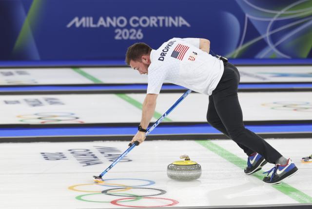 (260210) -- CORTINA D'AMPEZZO, Feb. 10, 2026 (Xinhua) -- Korey Dropkin of the United States competes during the curling mixed doubles gold medal match between Sweden and the United States at the Milan-Cortina 2026 Olympic Winter Games in Cortina, Italy, Feb. 10, 2026. (Xinhua/Ding Xu)