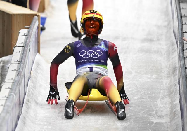 (260210) -- CORTINA D'AMPEZZO, Feb. 10, 2026 (Xinhua) -- Julia Taubitz of Germany celebrates during the luge women's singles run 4 at the Milan-Cortina 2026 Olympic Winter Games in Cortina, Italy, Feb. 10, 2026. (Xinhua/Lian Yi)