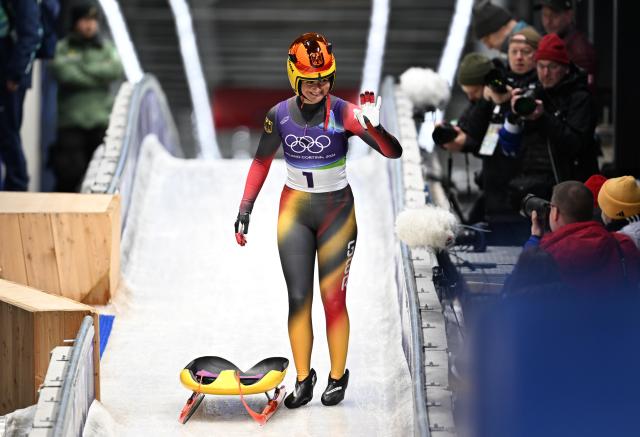 (260210) -- CORTINA D'AMPEZZO, Feb. 10, 2026 (Xinhua) -- Julia Taubitz of Germany celebrates during the luge women's singles run 3 at the Milan-Cortina 2026 Olympic Winter Games in Cortina, Italy, Feb. 10, 2026. (Xinhua/Lian Yi)