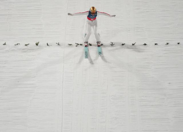(260210) -- PREDAZZO, Feb. 10, 2026 (Xinhua) -- Zeng Ping of China competes during the ski jumping mixed team final round match at the Milan-Cortina 2026 Olympic Winter Games in Predazzo, Italy, Feb. 10, 2026. (Xinhua/Huang Wei)