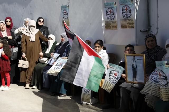 (260210) -- HEBRON, Feb. 10, 2026 (Xinhua) -- Palestinians and activists take part in a protest in front of the International Committee of the Red Cross (ICRC) office in Hebron City in the West Bank, on Feb. 10, 2026. Protesters condemned Israel for blocking the Red Cross's humanitarian work and called on the international community to uphold international law and ensure the ICRC's free operation. (Photo by Mamoun Wazwaz/Xinhua)