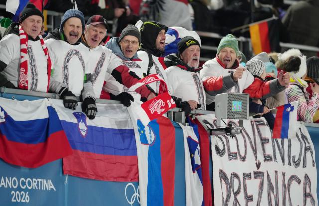 (260210) -- PREDAZZO, Feb. 10, 2026 (Xinhua) -- Spectators cheer for athletes during the ski jumping mixed team final round match at the Milan-Cortina 2026 Olympic Winter Games in Predazzo, Italy, Feb. 10, 2026. (Xinhua/Huang Wei)