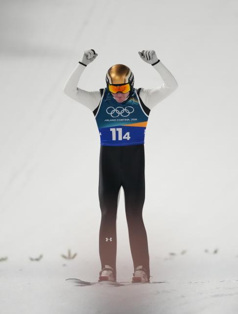 (260210) -- PREDAZZO, Feb. 10, 2026 (Xinhua) -- Domen Prevc of Slovenia celebrates during the ski jumping mixed team final round match at the Milan-Cortina 2026 Olympic Winter Games in Predazzo, Italy, Feb. 10, 2026. (Xinhua/Huang Wei)