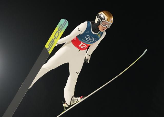 (260210) -- PREDAZZO, Feb. 10, 2026 (Xinhua) -- Maruyama Nozomi of Japan competes during the 1st round match of ski jumping mixed team at the Milan-Cortina 2026 Olympic Winter Games in Predazzo, Italy, Feb. 10, 2026. (Xinhua/Meng Yongmin)