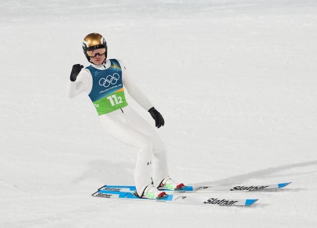 (260210) -- PREDAZZO, Feb. 10, 2026 (Xinhua) -- Anze Lanisek of Slovenia reacts during the ski jumping mixed team final round match at the Milan-Cortina 2026 Olympic Winter Games in Predazzo, Italy, Feb. 10, 2026. (Xinhua/Meng Yongmin)