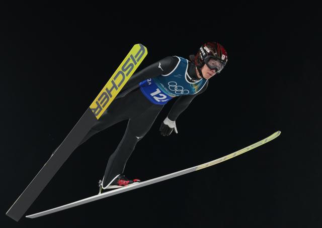 (260210) -- PREDAZZO, Feb. 10, 2026 (Xinhua) -- Nikaido Ren of Japan competes during the 1st round match of ski jumping mixed team at the Milan-Cortina 2026 Olympic Winter Games in Predazzo, Italy, Feb. 10, 2026. (Xinhua/Meng Yongmin)