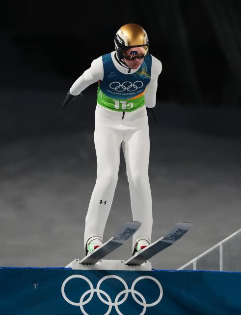(260210) -- PREDAZZO, Feb. 10, 2026 (Xinhua) -- Anze Lanisek of Slovenia competes during the trial round match of ski jumping mixed team at the Milan-Cortina 2026 Olympic Winter Games in Predazzo, Italy, Feb. 10, 2026. (Xinhua/Meng Yongmin)