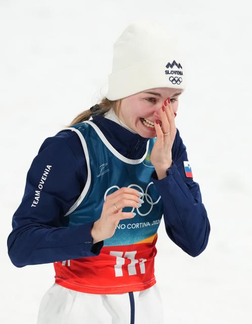 (260210) -- PREDAZZO, Feb. 10, 2026 (Xinhua) -- Nika Vodan of Slovenia celebrates after winning the ski jumping mixed team match at the Milan-Cortina 2026 Olympic Winter Games in Predazzo, Italy, Feb. 10, 2026. (Xinhua/Meng Yongmin)