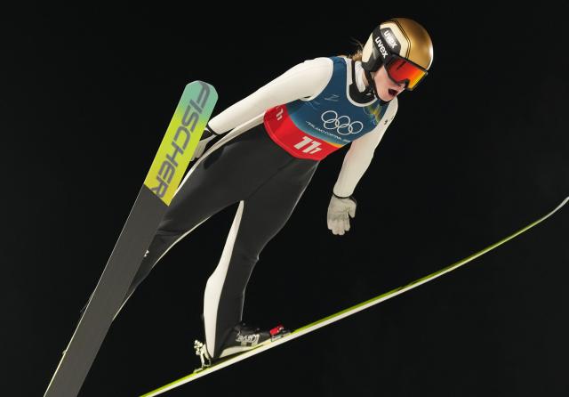 (260210) -- PREDAZZO, Feb. 10, 2026 (Xinhua) -- Nika Vodan of Slovenia competes during the 1st round match of ski jumping mixed team at the Milan-Cortina 2026 Olympic Winter Games in Predazzo, Italy, Feb. 10, 2026. (Xinhua/Meng Yongmin)