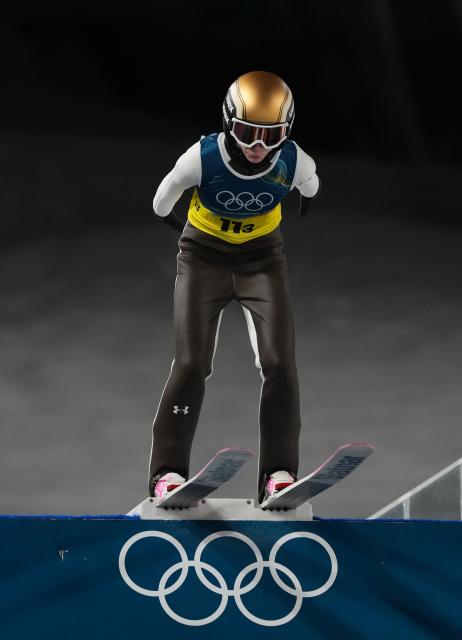 (260210) -- PREDAZZO, Feb. 10, 2026 (Xinhua) -- Nika Prevc of Slovenia competes during the trial round match of ski jumping mixed team at the Milan-Cortina 2026 Olympic Winter Games in Predazzo, Italy, Feb. 10, 2026. (Xinhua/Meng Yongmin)