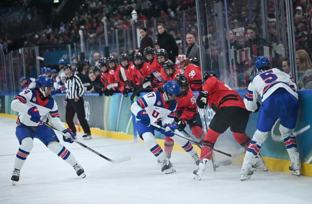 (260210) -- MILAN, Feb. 10, 2026 (Xinhua) -- Britta Curl (2nd R) of the United States vies with players of Canada during the ice hockey women's preliminary round group A match between Canada and the United States at the Milan-Cortina 2026 Olympic Winter Games in Milan, Italy, Feb. 10, 2026. (Xinhua/Zhang Haofu)