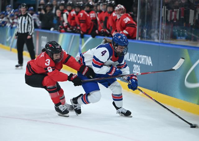 (260210) -- MILAN, Feb. 10, 2026 (Xinhua) -- Jocelyne Larocque (L) of Canada vies with Caroline Harvey of the United States during the ice hockey women's preliminary round group A match between Canada and the United States at the Milan-Cortina 2026 Olympic Winter Games in Milan, Italy, Feb. 10, 2026. (Xinhua/Zhang Haofu)