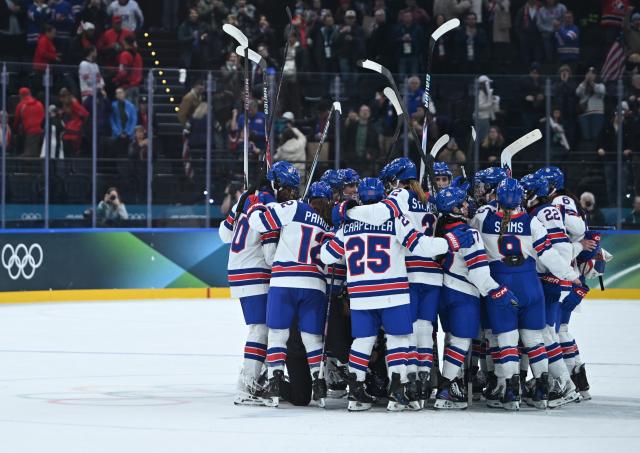 (260210) -- MILAN, Feb. 10, 2026 (Xinhua) -- Players of the United States celebrate after the ice hockey women's preliminary round group A match between Canada and the United States at the Milan-Cortina 2026 Olympic Winter Games in Milan, Italy, Feb. 10, 2026. (Xinhua/Zhang Haofu)
