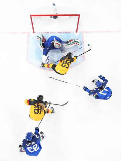 (260210) -- MILAN, Feb. 10, 2026 (Xinhua) -- Laura Kluge (2nd from top) of Germany shoots to score during the ice hockey women's preliminary round group B match between Germany and Italy of the Milan-Cortina 2026 Olympic Winter Games in Milan, Italy, Feb. 10, 2026. (Xinhua/Wang Kaiyan)