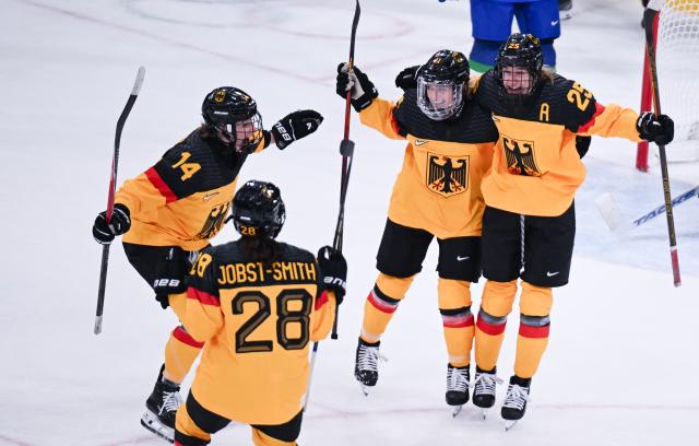 (260210) -- MILAN, Feb. 10, 2026 (Xinhua) -- Laura Kluge (2nd R) of Germany celebrates her goal during the ice hockey women's preliminary round group B match between Germany and Italy of the Milan-Cortina 2026 Olympic Winter Games in Milan, Italy, Feb. 10, 2026. (Xinhua/Tao Xiyi)