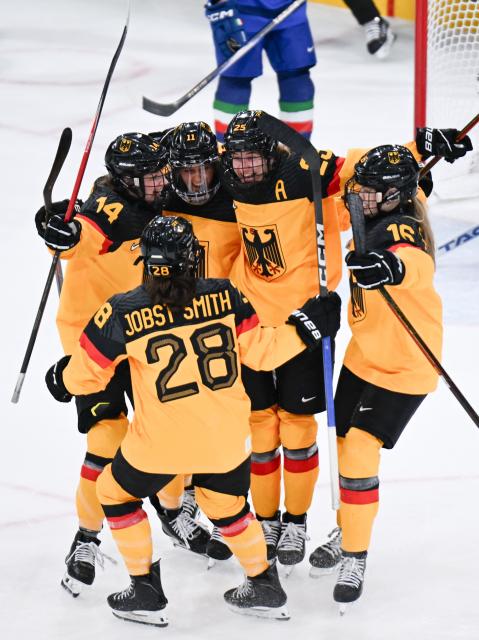 (260210) -- MILAN, Feb. 10, 2026 (Xinhua) -- Laura Kluge (2nd R) of Germany celebrates her goal during the ice hockey women's preliminary round group B match between Germany and Italy of the Milan-Cortina 2026 Olympic Winter Games in Milan, Italy, Feb. 10, 2026. (Xinhua/Tao Xiyi)