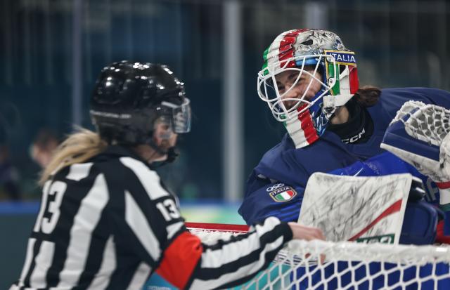 (260210) -- MILAN, Feb. 10, 2026 (Xinhua) -- Goalkeeper Gabriella Durante (R) of Italy talks with the referee during the ice hockey women's preliminary round group B match between Germany and Italy of the Milan-Cortina 2026 Olympic Winter Games in Milan, Italy, Feb. 10, 2026. (Xinhua/Wang Kaiyan)