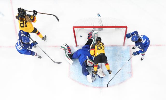 (260210) -- MILAN, Feb. 10, 2026 (Xinhua) -- Laura Kluge (2nd R) of Germany scores during the ice hockey women's preliminary round group B match between Germany and Italy of the Milan-Cortina 2026 Olympic Winter Games in Milan, Italy, Feb. 10, 2026. (Xinhua/Wang Kaiyan)