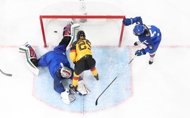 (260210) -- MILAN, Feb. 10, 2026 (Xinhua) -- Laura Kluge (C) of Germany scores during the ice hockey women's preliminary round group B match between Germany and Italy of the Milan-Cortina 2026 Olympic Winter Games in Milan, Italy, Feb. 10, 2026. (Xinhua/Wang Kaiyan)