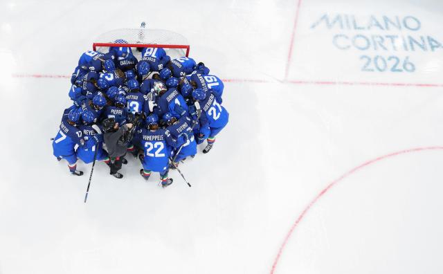 (260210) -- MILAN, Feb. 10, 2026 (Xinhua) -- Players of Italy cheer up before the ice hockey women's preliminary round group B match between Germany and Italy of the Milan-Cortina 2026 Olympic Winter Games in Milan, Italy, Feb. 10, 2026. (Xinhua/Wang Kaiyan)