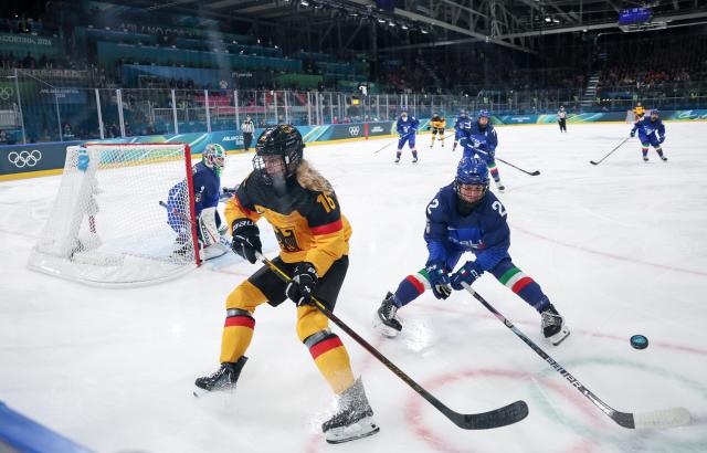 (260210) -- MILAN, Feb. 10, 2026 (Xinhua) -- Jule Schiefer (L) of Germany vies with Amie Varano of Italy during the ice hockey women's preliminary round group B match between Germany and Italy of the Milan-Cortina 2026 Olympic Winter Games in Milan, Italy, Feb. 10, 2026. (Xinhua/Wang Kaiyan)