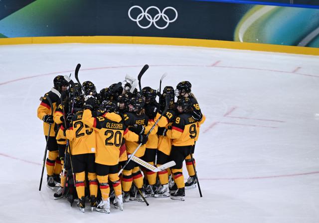 (260210) -- MILAN, Feb. 10, 2026 (Xinhua) -- Players of Germany celebrate victory after the ice hockey women's preliminary round group B match between Germany and Italy of the Milan-Cortina 2026 Olympic Winter Games in Milan, Italy, Feb. 10, 2026. (Xinhua/Tao Xiyi)