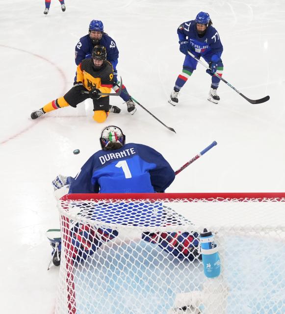 (260210) -- MILAN, Feb. 10, 2026 (Xinhua) -- Goalkeeper Gabriella Durante (bottom) of Italy saves during the ice hockey women's preliminary round group B match between Germany and Italy of the Milan-Cortina 2026 Olympic Winter Games in Milan, Italy, Feb. 10, 2026. (Wang Kaiyan/Pool via Xinhua)