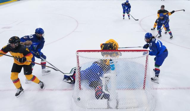 (260210) -- MILAN, Feb. 10, 2026 (Xinhua) -- Laura Kluge (C) of Germany shoots to score during the ice hockey women's preliminary round group B match between Germany and Italy of the Milan-Cortina 2026 Olympic Winter Games in Milan, Italy, Feb. 10, 2026. (Wang Kaiyan/Pool via Xinhua)