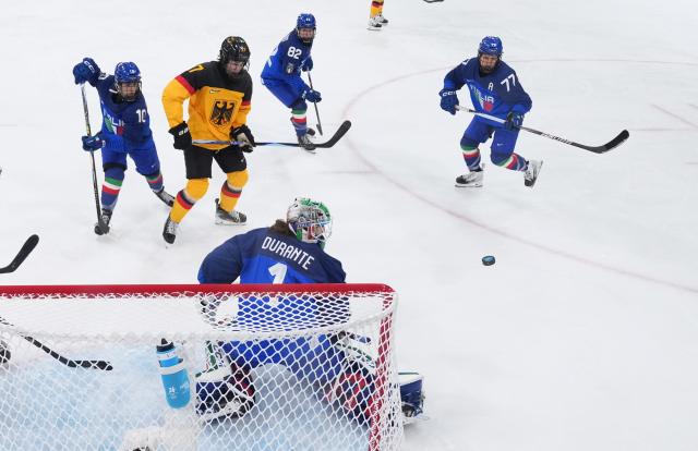(260211) -- MILAN, Feb. 11, 2026 (Xinhua) -- Players of both teams compete during the ice hockey women's preliminary round group B match between Germany and Italy of the Milan-Cortina 2026 Olympic Winter Games in Milan, Italy, Feb. 10, 2026. (Xinhua/Wang Kaiyan)