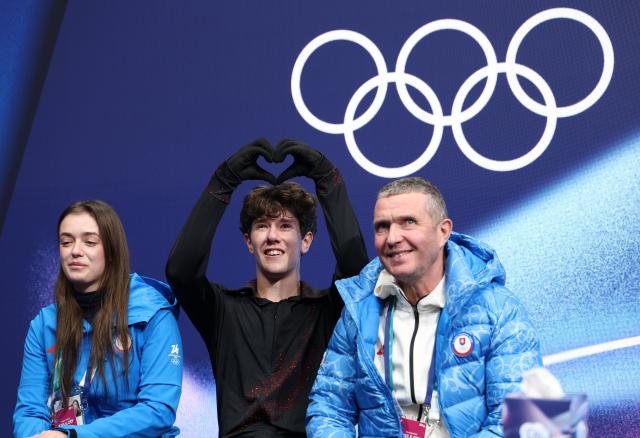 (260211) -- MILAN, Feb. 11, 2026 (Xinhua) -- Adam Hagara (C) of Slovakia waits for the scores after performing during the short program competition of figure skating men single skating at the Milan-Cortina 2026 Olympic Winter Games in Milan, Italy, Feb. 10, 2026. (Xinhua/Li Ming)