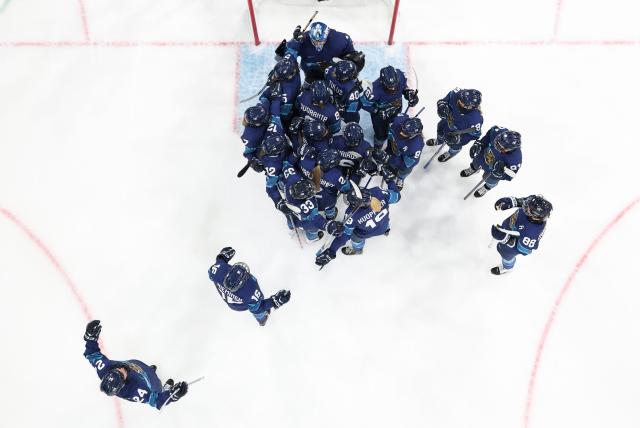 (260211) -- MILAN, Feb. 11, 2026 (Xinhua) -- Players of Finland celebrate victory after the ice hockey women's preliminary round group A match between Finland and Switzerland of the Milan-Cortina 2026 Olympic Winter Games in Milan, Italy, Feb. 10, 2026. (Xinhua/Wang Kaiyan)