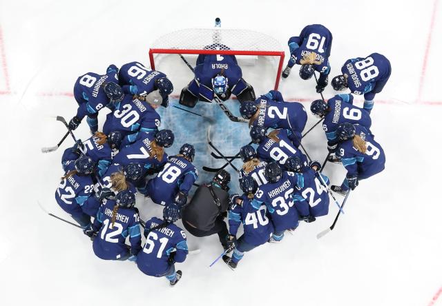 (260211) -- MILAN, Feb. 11, 2026 (Xinhua) -- Players of Finland cheer up before the ice hockey women's preliminary round group A match between Finland and Switzerland of the Milan-Cortina 2026 Olympic Winter Games in Milan, Italy, Feb. 10, 2026. (Xinhua/Wang Kaiyan)